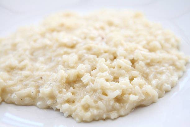 istock risotto dish with herbs on wood background 483614653