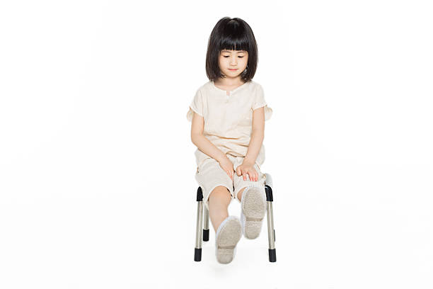istock cute asian girl sitting on the bench 483615100