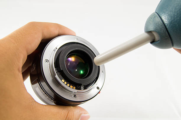 istock Cleaning camera lens, Blow len by blower 483615171
