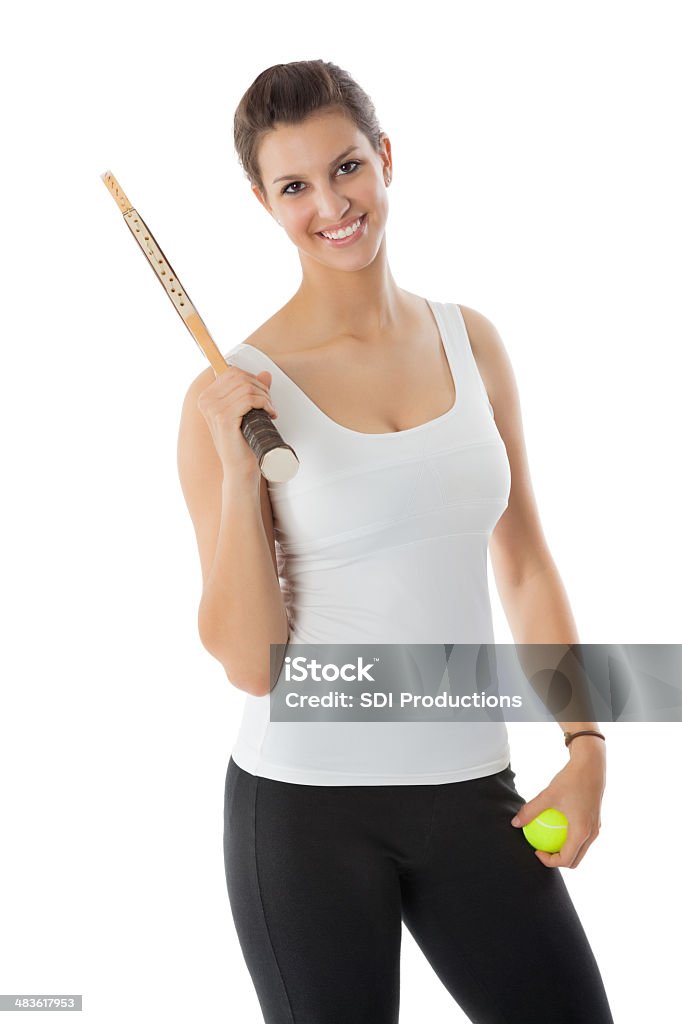 Mujer jugador de tenis de retención de raqueta; Foto de estudio - Foto de stock de Actividad libre de derechos