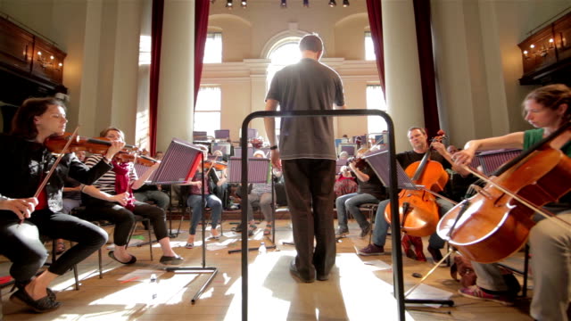 Orchestra with conductor wide angle