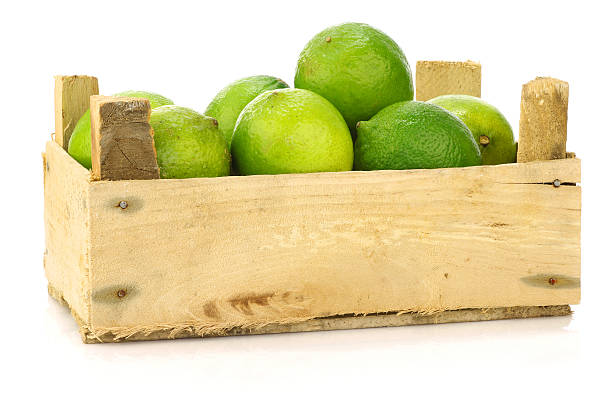 istock fresh lime fruit in a wooden crate 483619045