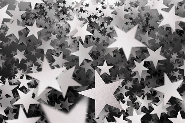 istock Hundreds of falling silver confetti stars 483620861