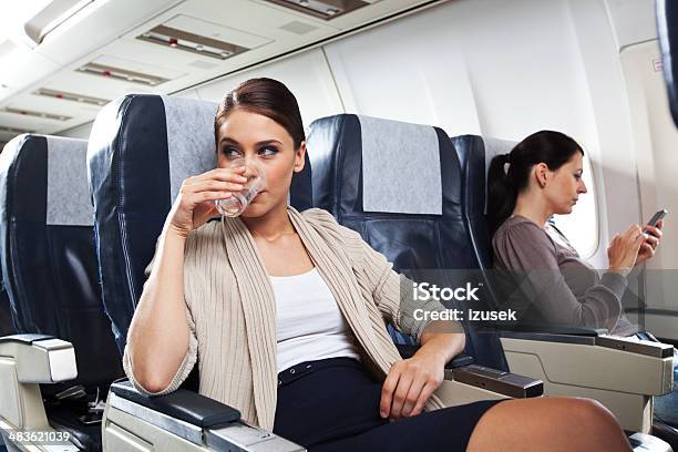 On The Airplane Stock Photo - Download Image Now - Airplane, Drinking, Passenger Cabin