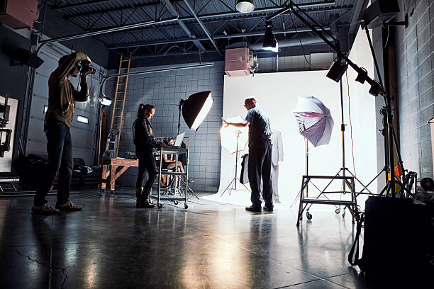 Film Crew Working on Set Film crew working on a set. camera man stock pictures, royalty-free photos & images