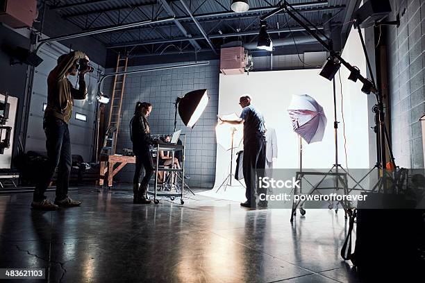 Film Crew Working On Set Stock Photo - Download Image Now - Film Set, Behind The Scenes, Film Crew