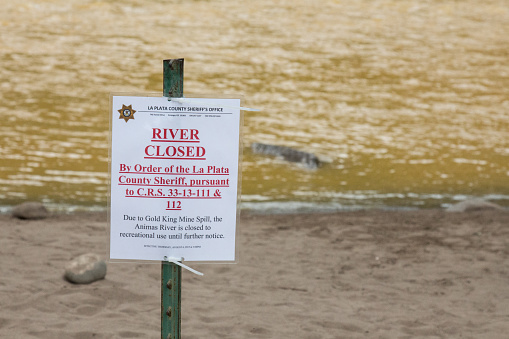 Durango, Colorado, USA - August 7, 2015: River closed sign on the Animas due to toxic waste released by the EPA at the King Gold mine in Silverton.