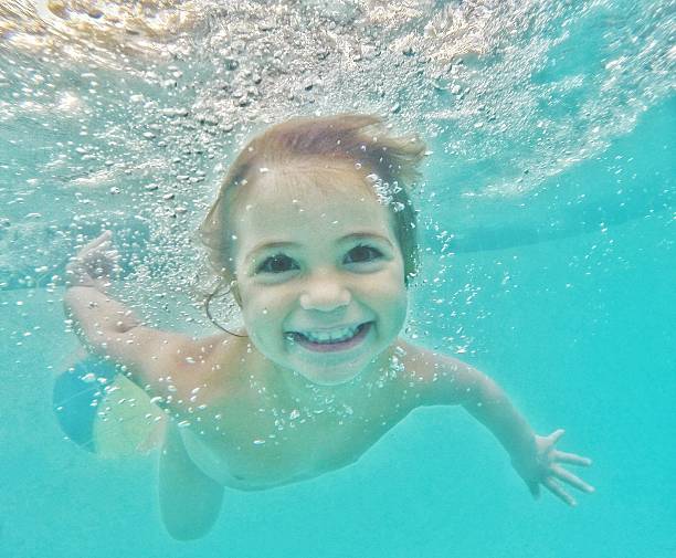 the swimmer - baby swim under water bildbanksfoton och bilder