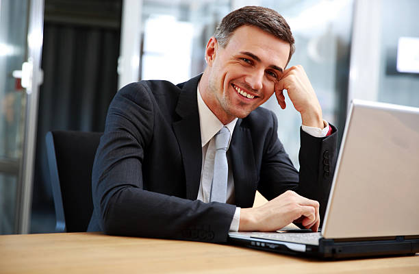 istock businessman sitting with laptop 483626679
