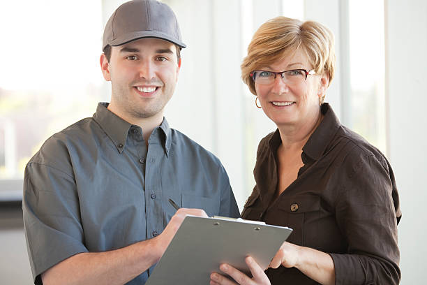 istock Service Personnel with a Customer 483628037