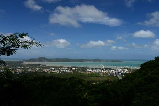 The view from the mountains to Chalong in the south of the island of Phuket in the south of Thailand in South East Asia.