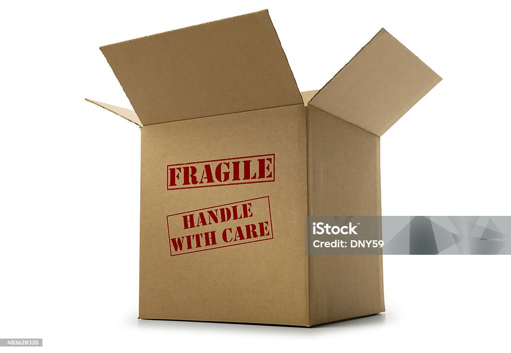 Box labeled fragile and handle with care on white background "Fragile Handle With Care" stamped on front of open box.  For blank box version see file #3389682 Box - Container Stock Photo