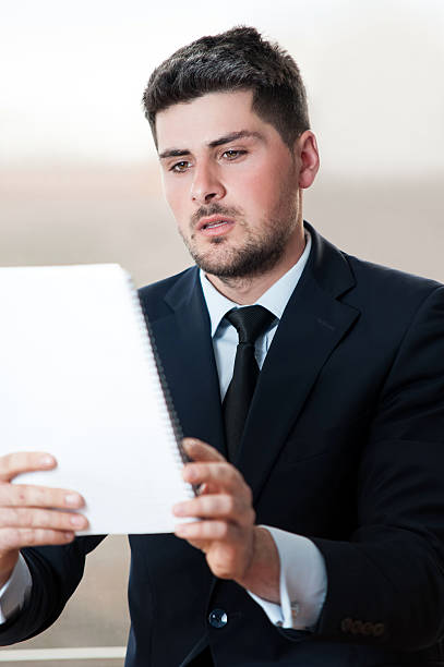 istock Young business man looking at flip chart 483629083