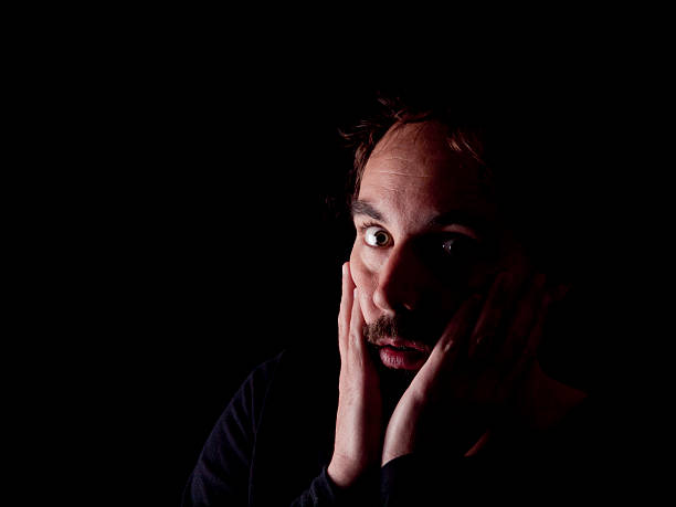istock Low key image of a bearded man with shocked expression 483629697