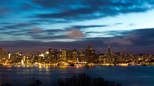 istock San Francisco Bay Bridge and skyline at night 483630350