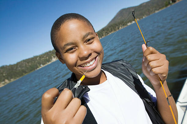 istock Boy Enjoying Fishing on Lake 483630683
