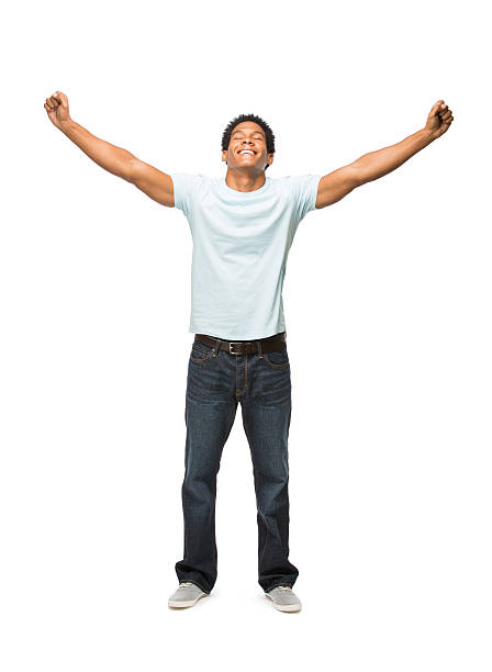 Young latin man holding both arms in the air