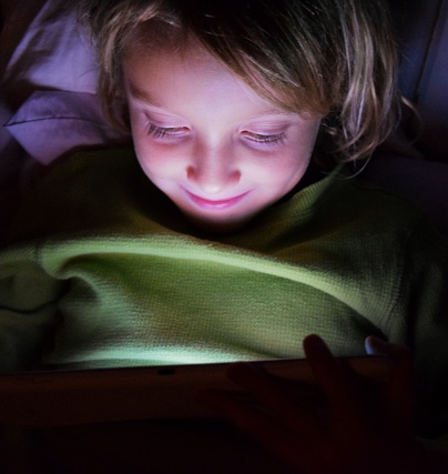 Screentime at night for a young girl