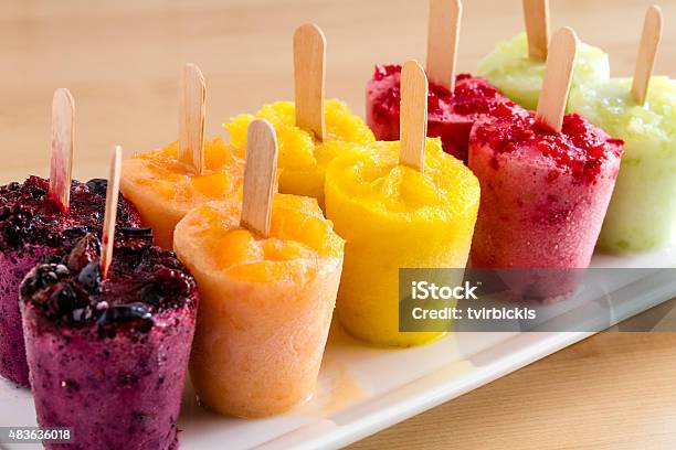 Homemade Fresh Pureed Fruit Frozen Popsicles Stock Photo - Download Image Now - 2015, Blackberry - Fruit, Blue