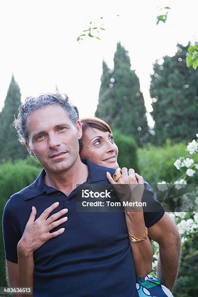 Couple Hugging Outdoors Stock Photo - Download Image Now - 50-59 Years, Care, Family