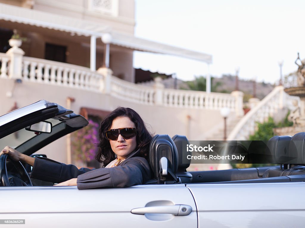 Woman driving convertible  Convertible Stock Photo