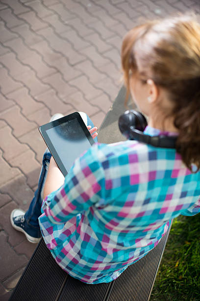 istock Beautiful young woman student with note pad. Outdoor student 483643862
