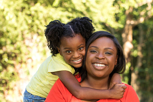 istock Mother laughing and hugging her daughter 483651566