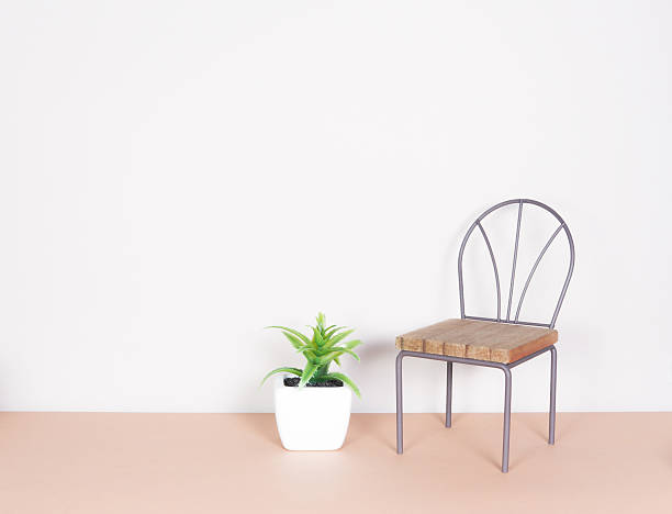 istock plastic plant and mini chair, minimalism style 483654324