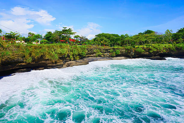 istock Tanah Lot temple side road 483654486