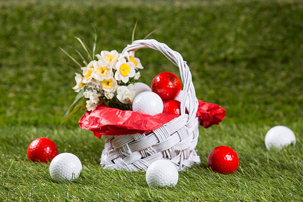 Easter Basket with Golf Balls and Flowers stock photo