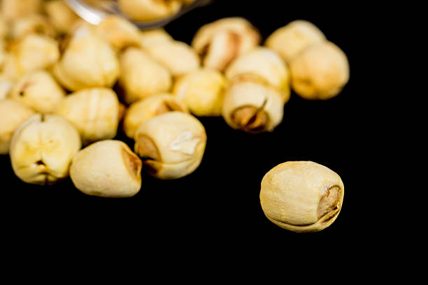 dried chinese lotus seeds isolated on black