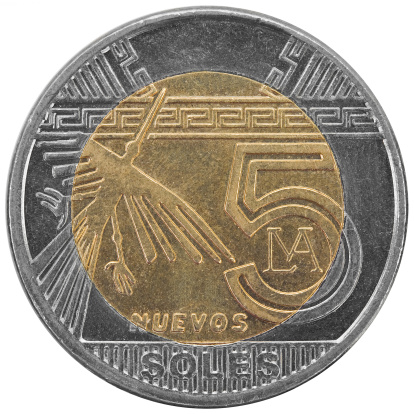 Peruvian five soles coin isolated on white background.