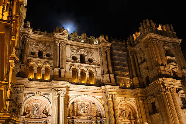 The front facade of Cathedral de Malaga with illumination at  night.