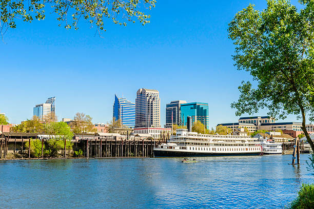 Sacramento California skyline, cityscape, riverfront, river. State Capital. Sacramento skyline and riverfront on the Sacramento River. sacramento ca stock pictures, royalty-free photos & images