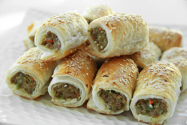 istock Homemade sausage rolls on white plate 483658932