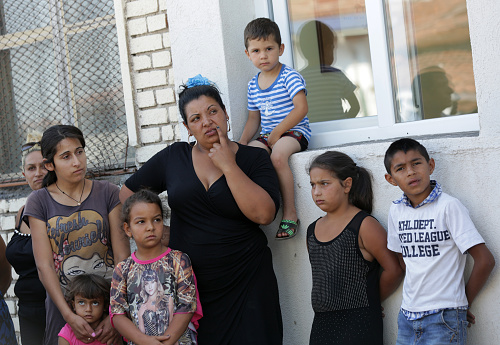 Sofia, Bulgaria - July 30, 2015: Gypsies mothers and their children are attending at the official opening of a center in their neighborhood for mothers and children in risk.