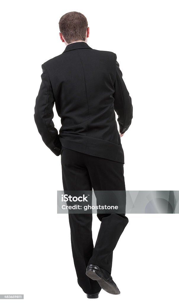 Vista posterior de un hombre de negocios en marcha. - Foto de stock de Actividad libre de derechos