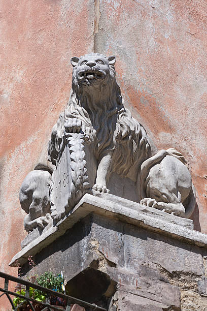 istock double-sided split statue of a lion on the house corner 483659824