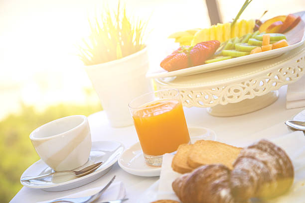 istock Fruit and orange juice in front of the sea 483662057