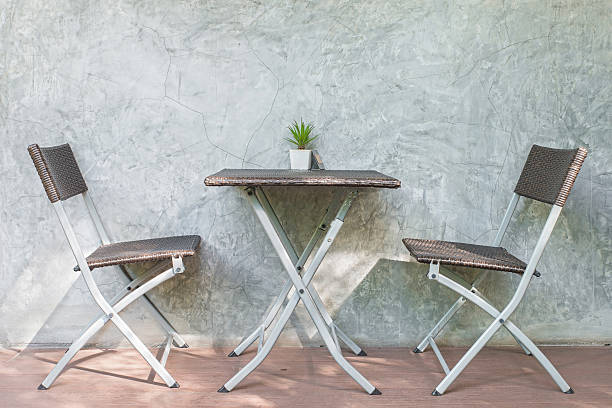 istock Chair and table on wood patio 483662508