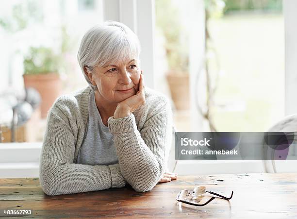 Lost In Pleasant Memories Stock Photo - Download Image Now - Widow, Senior Women, Hand On Chin