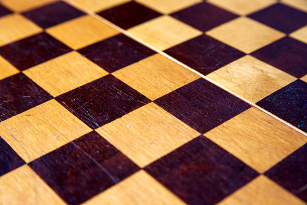 istock Retro wooden chessboard close-up 483662840