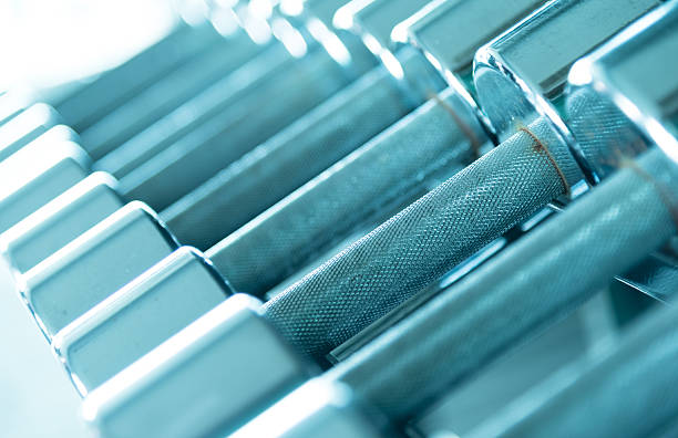 istock Row of dumbells  side view in aqua blue tone 483666082