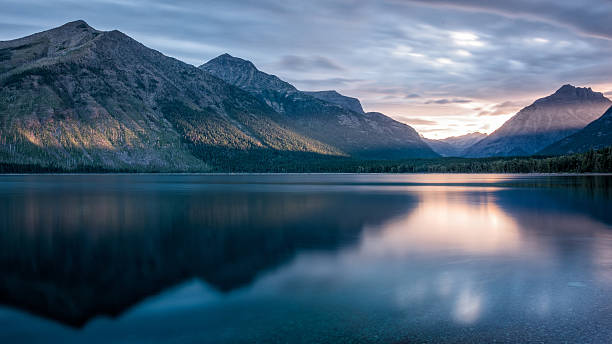 Mountain reflection at sunrise stock photo