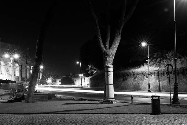 istock street in Rome at night with light trails 483668432
