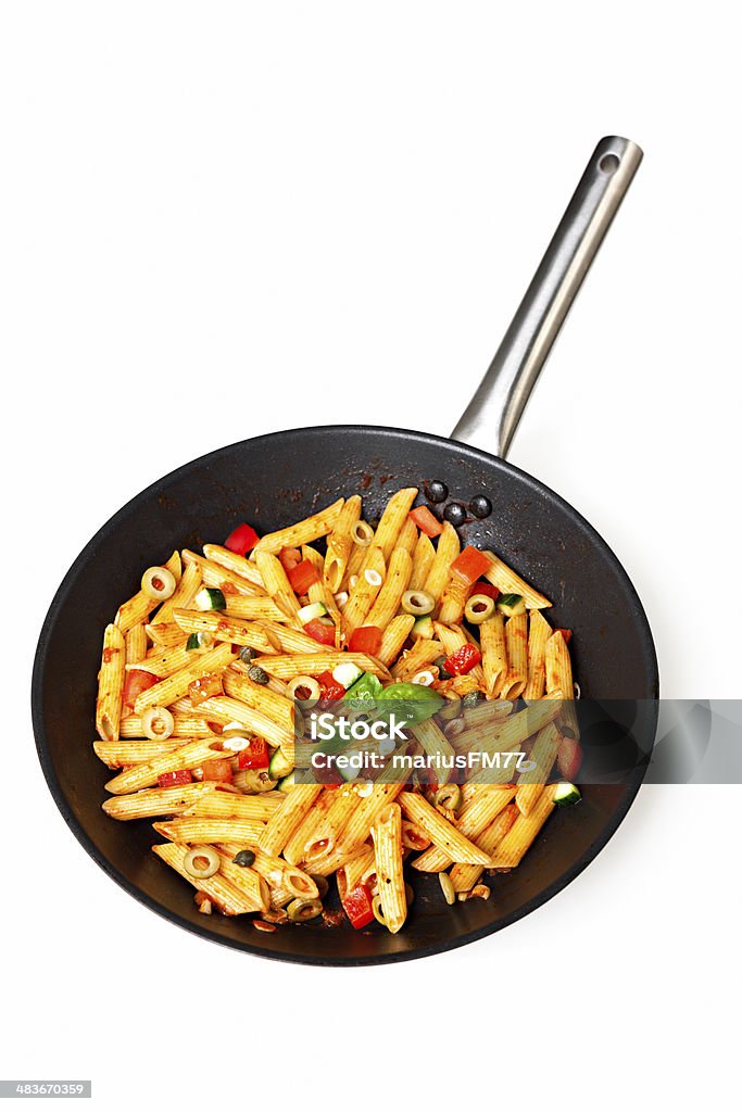 pasta ialian penne dish over white Basil Stock Photo