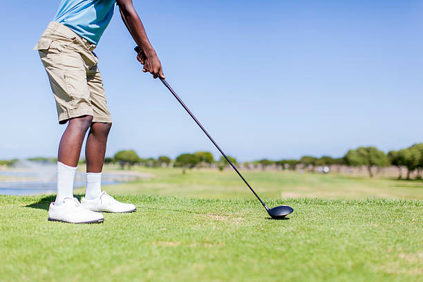 istock African golfer preparing himself to hit the golf ball 483671917