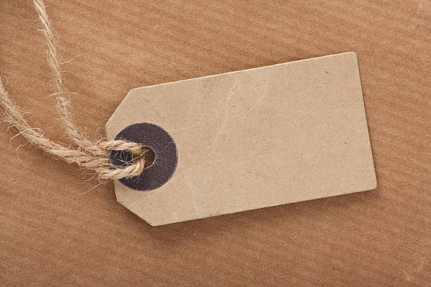 istock Brown Luggage Tag on Parcel Paper 483672173