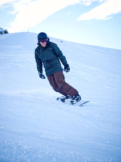 istock Male snowboarder with helmet in the Austrian Alps 483672569