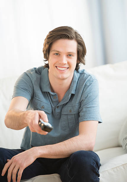 istock Man Watching TV In Living Room 483672761
